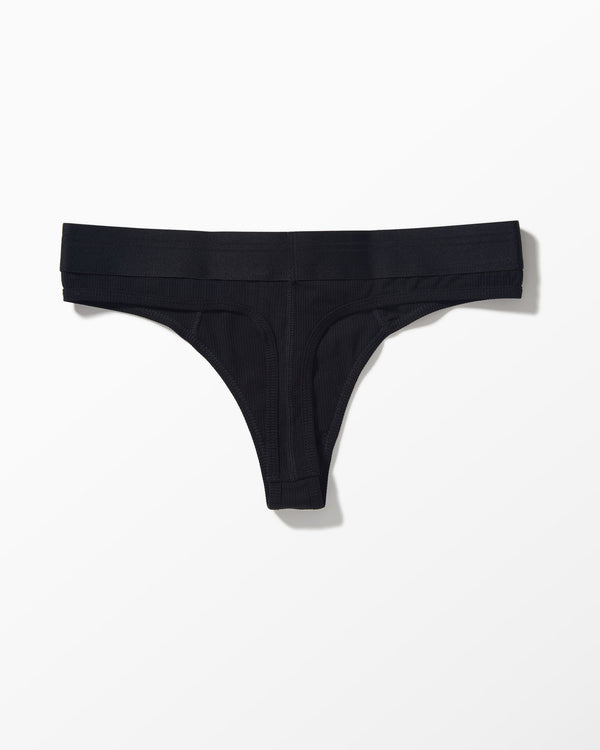 Black Ribbed Thong studio flat-lay — YYCG women's ribbed bamboo-rayon underwear