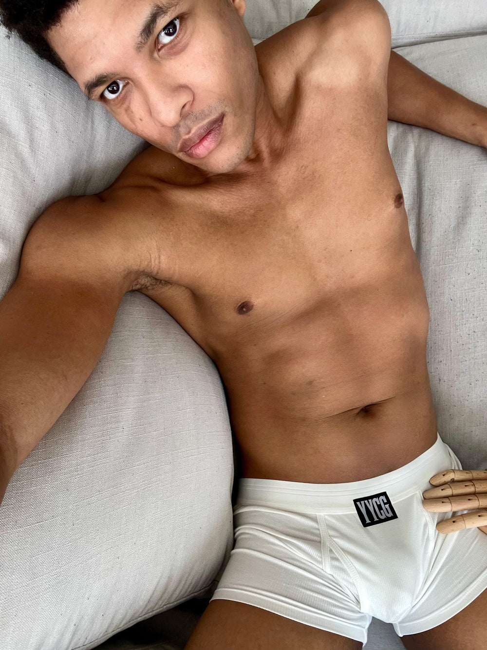 Model wearing the white Ribbed Boxer Brief — YYCG men's ribbed bamboo-rayon underwear
