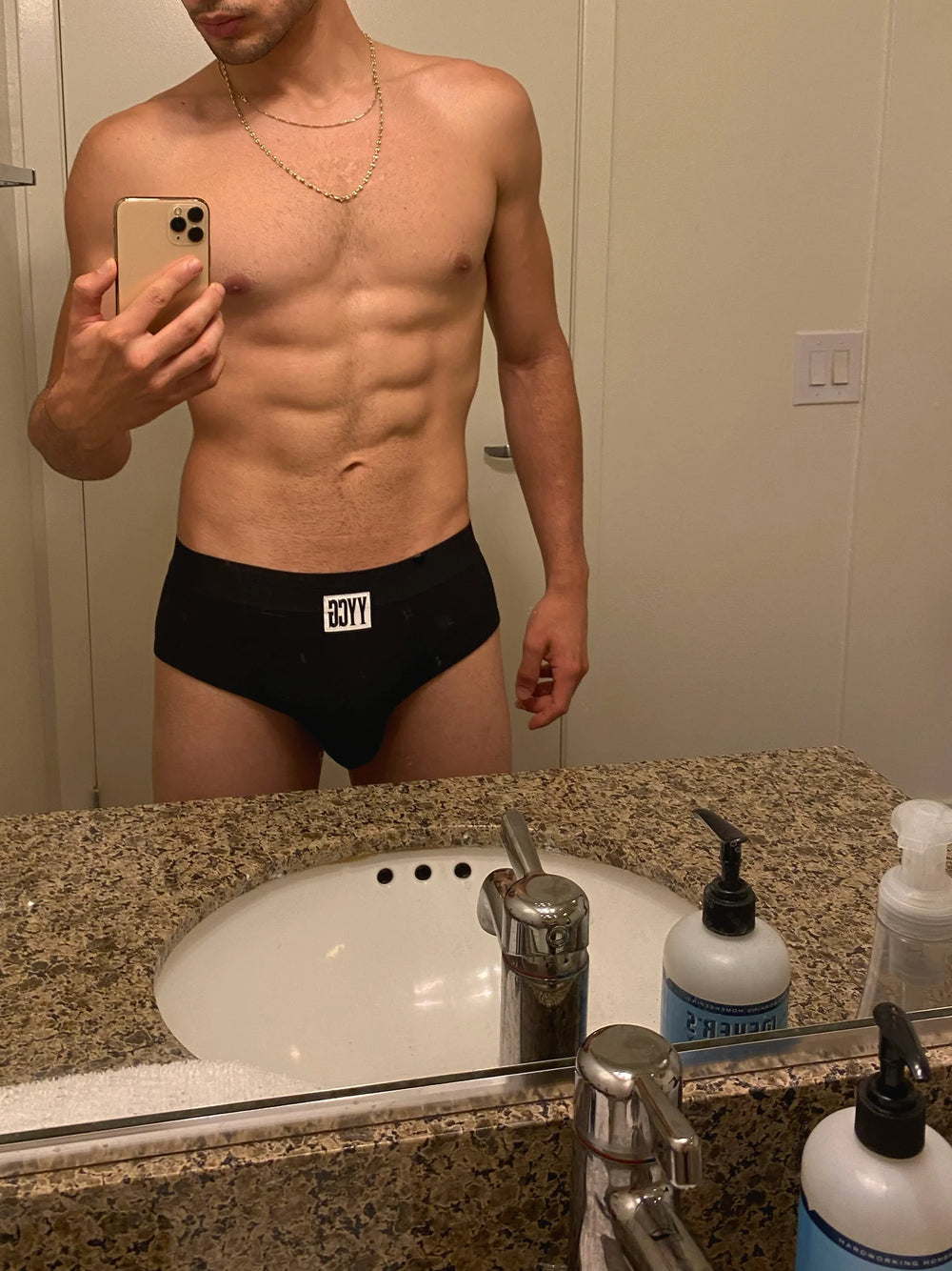 Model wearing the black Ribbed Brief — YYCG men's ribbed bamboo-rayon underwear

