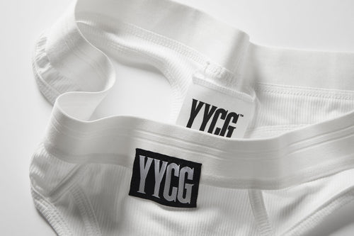 White Ribbed Thong studio flat-lay — YYCG women's ribbed bamboo-rayon underwear
