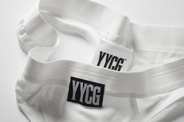 White Ribbed Thong studio flat-lay — YYCG women's ribbed bamboo-rayon underwear
