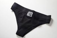 Black Ribbed Boy Brief studio flat-lay — YYCG women's ribbed bamboo-rayon underwear
