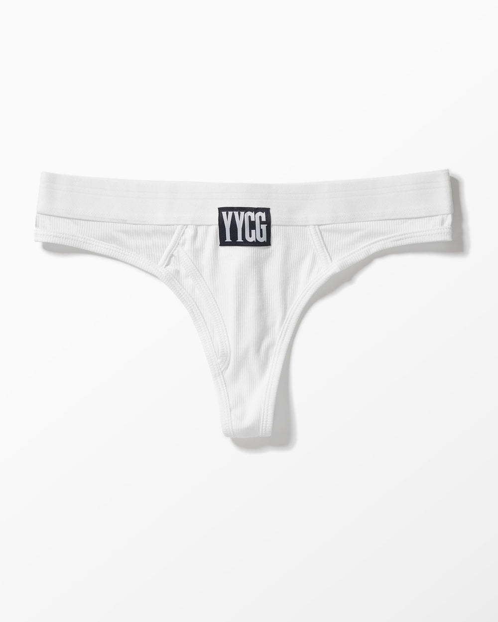 White Ribbed Thong studio flat-lay — YYCG women's ribbed bamboo-rayon underwear
