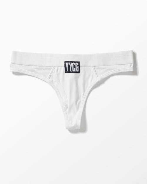 White Ribbed Thong studio flat-lay — YYCG women's ribbed bamboo-rayon underwear
