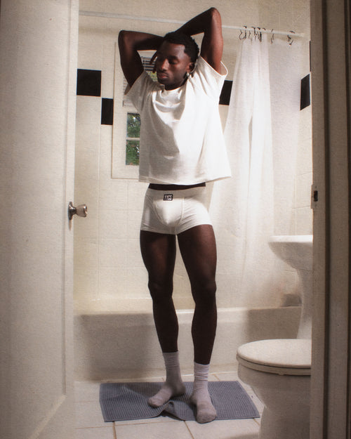 Model wearing the white T-Shirt — YYCG heavyweight 100% cotton tee
