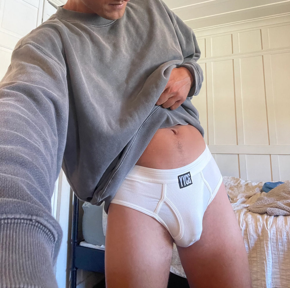 Model wearing the white Ribbed Brief — YYCG men's ribbed bamboo-rayon underwear
